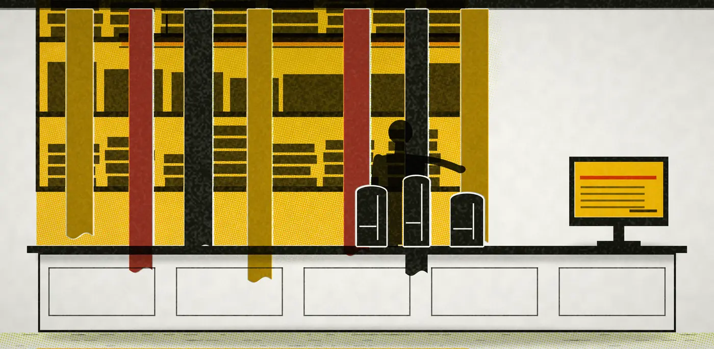 A cloth shop, printed: lengths of fabric hang the full height of the frame in saffron, red and ink, shelves of folded bolts behind, three bolts stood on the counter and the billing screen lit at the end under a fluorescent batten.